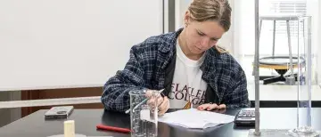  Zoie Marchant analyzes some data while in the science lab
