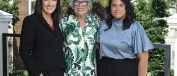 Laura Moody, Anila Lahiri, and Janet English stand beside eachother for a posed photo