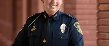 fall-2021-law-enforcement-jennifer-michaux-505x505.jpg In uniform, Jennifer Michaux, Chief of Police for the city of St. Augustine, poses near the Ponce Hall pillars