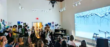 Crowd watching projected video in CEAM during FMFF 