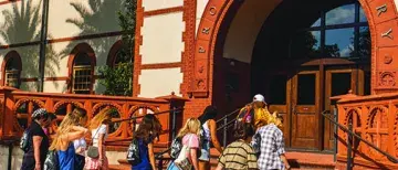 Class of 2026 students entering proctor library