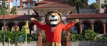 Lewis the Lion poses outside Flagler College