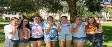 Deaf Awareness Week Students on Lawn performing ASL