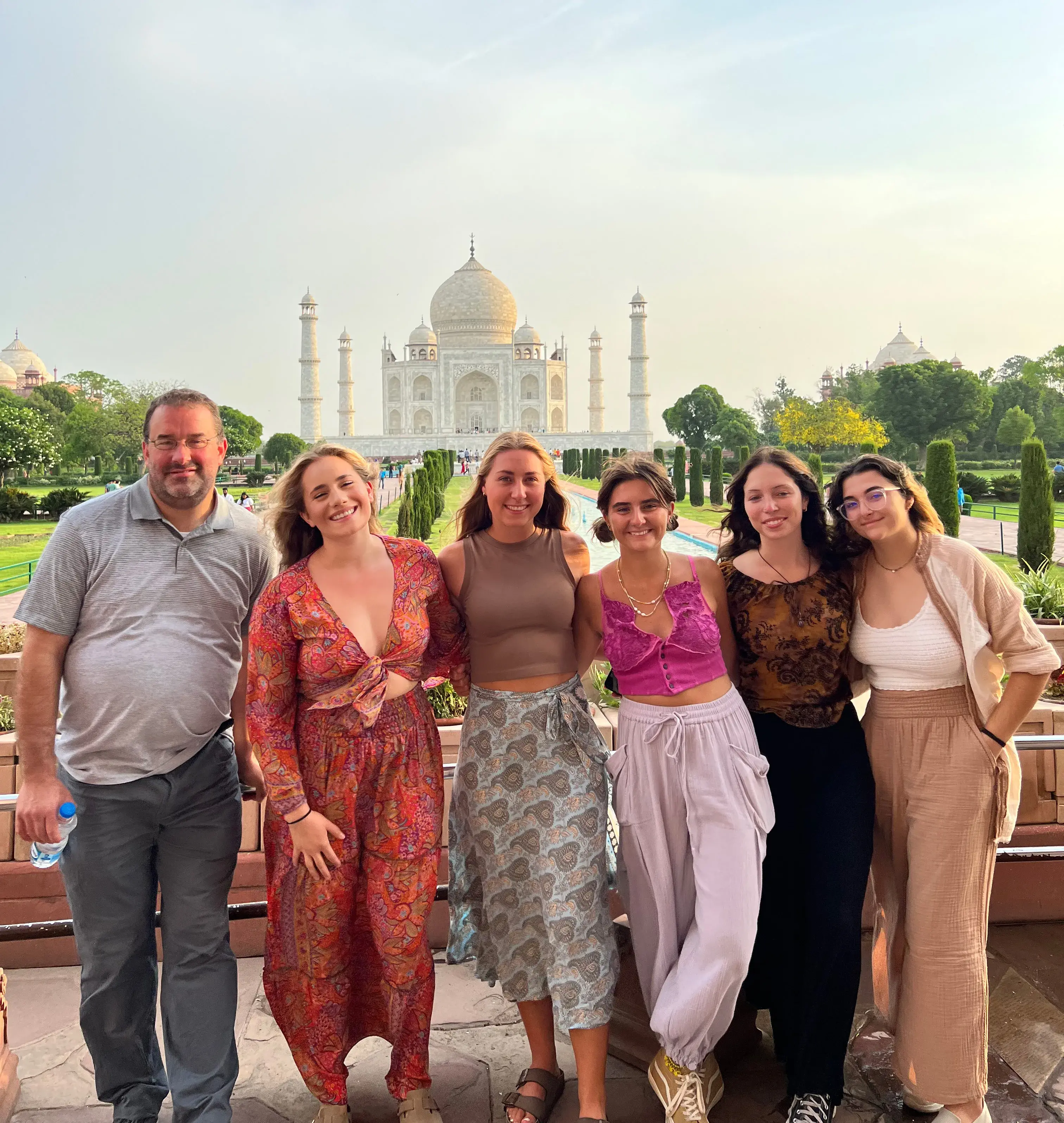 Group of people standing in front of the Taj Mahal