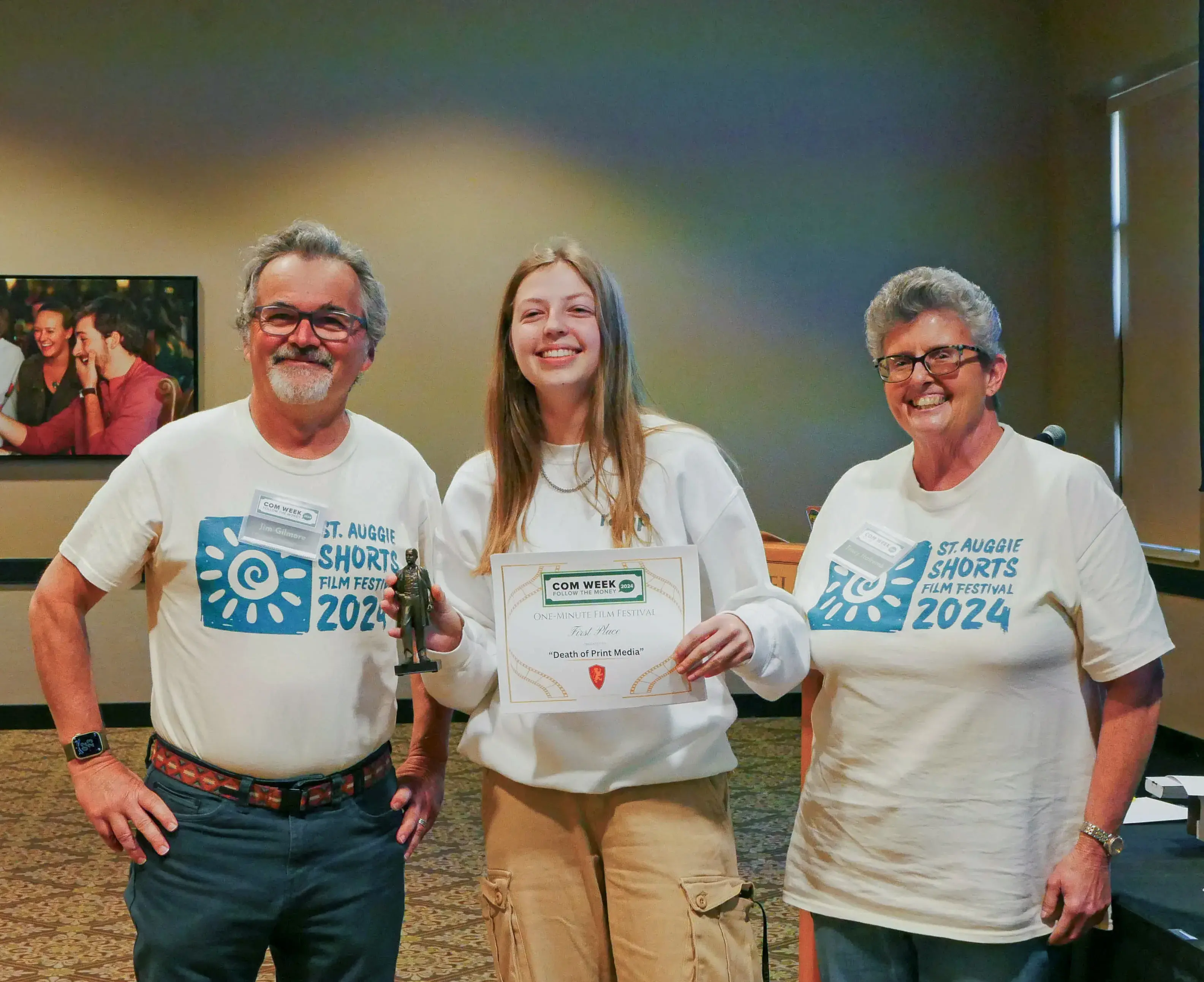 Member of 1st-place short film team accepting award