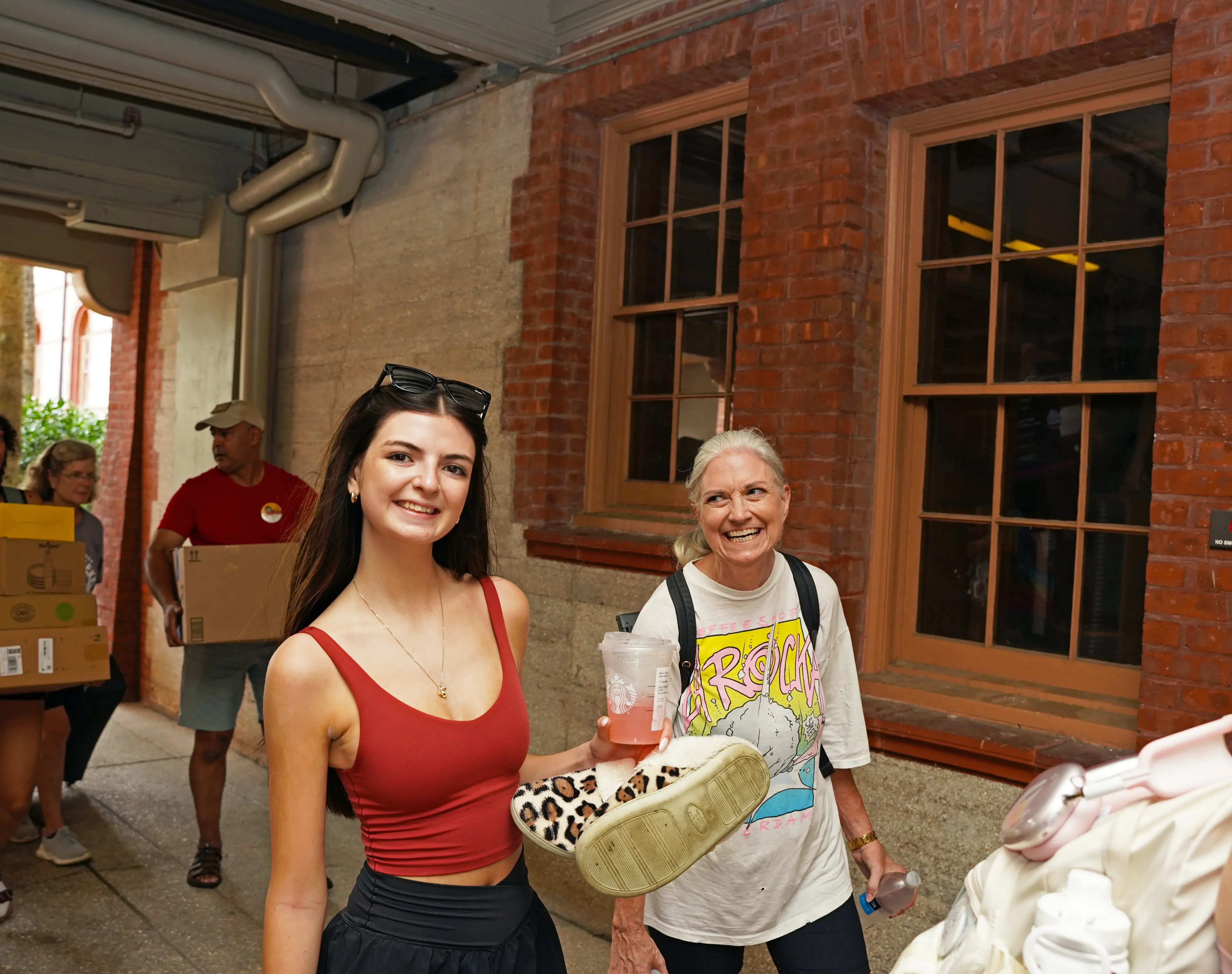 Mom smiling at daughter as they enter Breezeway