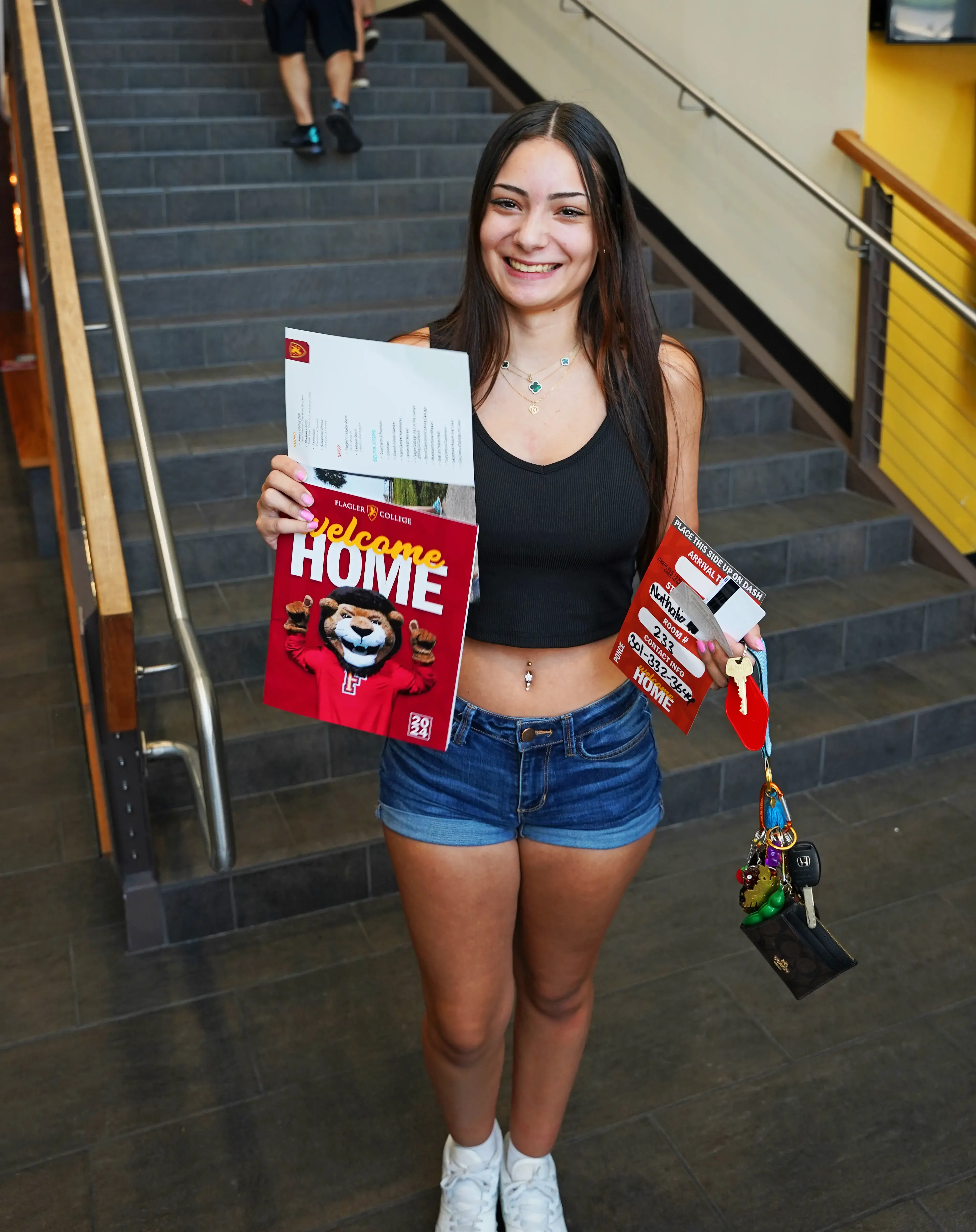 Student holding Welcome Packet