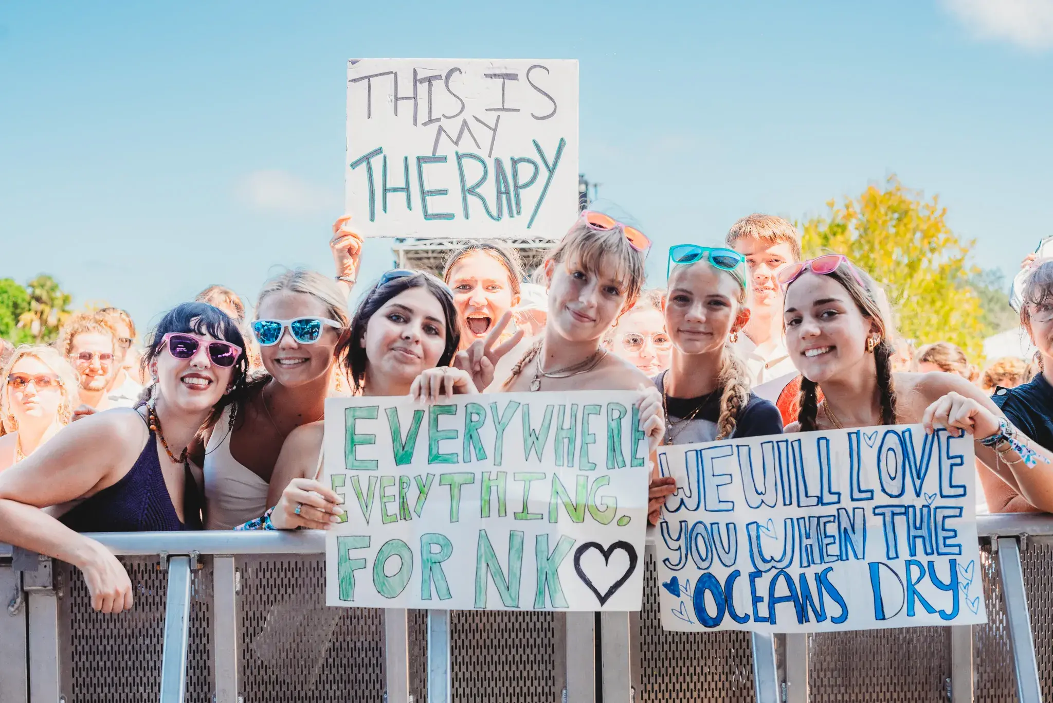 Students holding signs at sing out loud