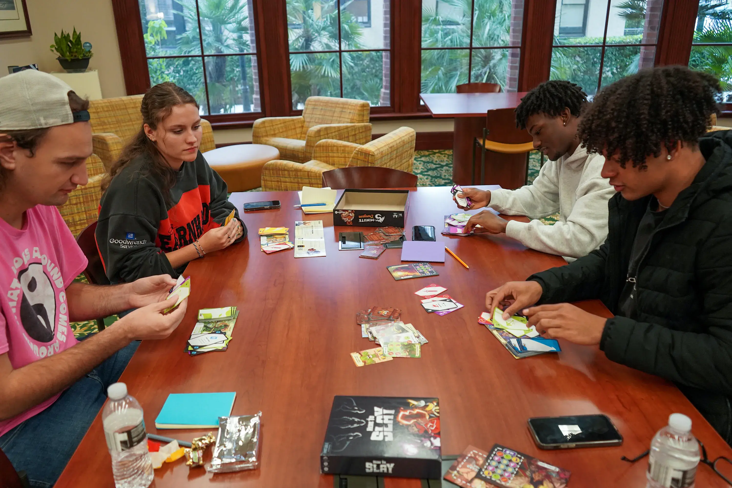 Group of students playing tabletop game in Library