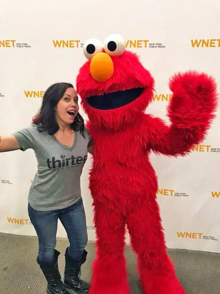 Amanita posing with Elmo at WNET event