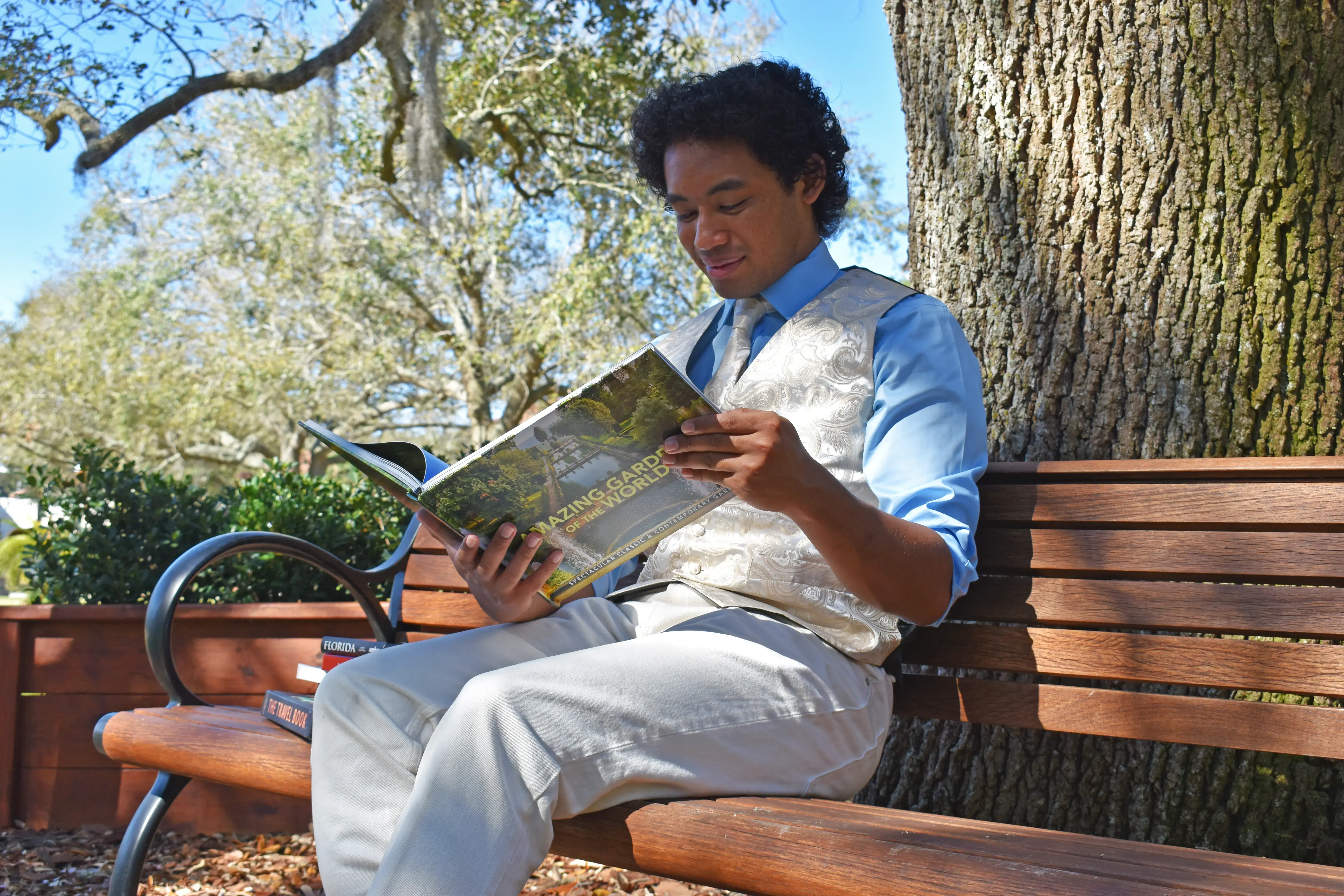 Chris reading "Amazing Gardens of the World"