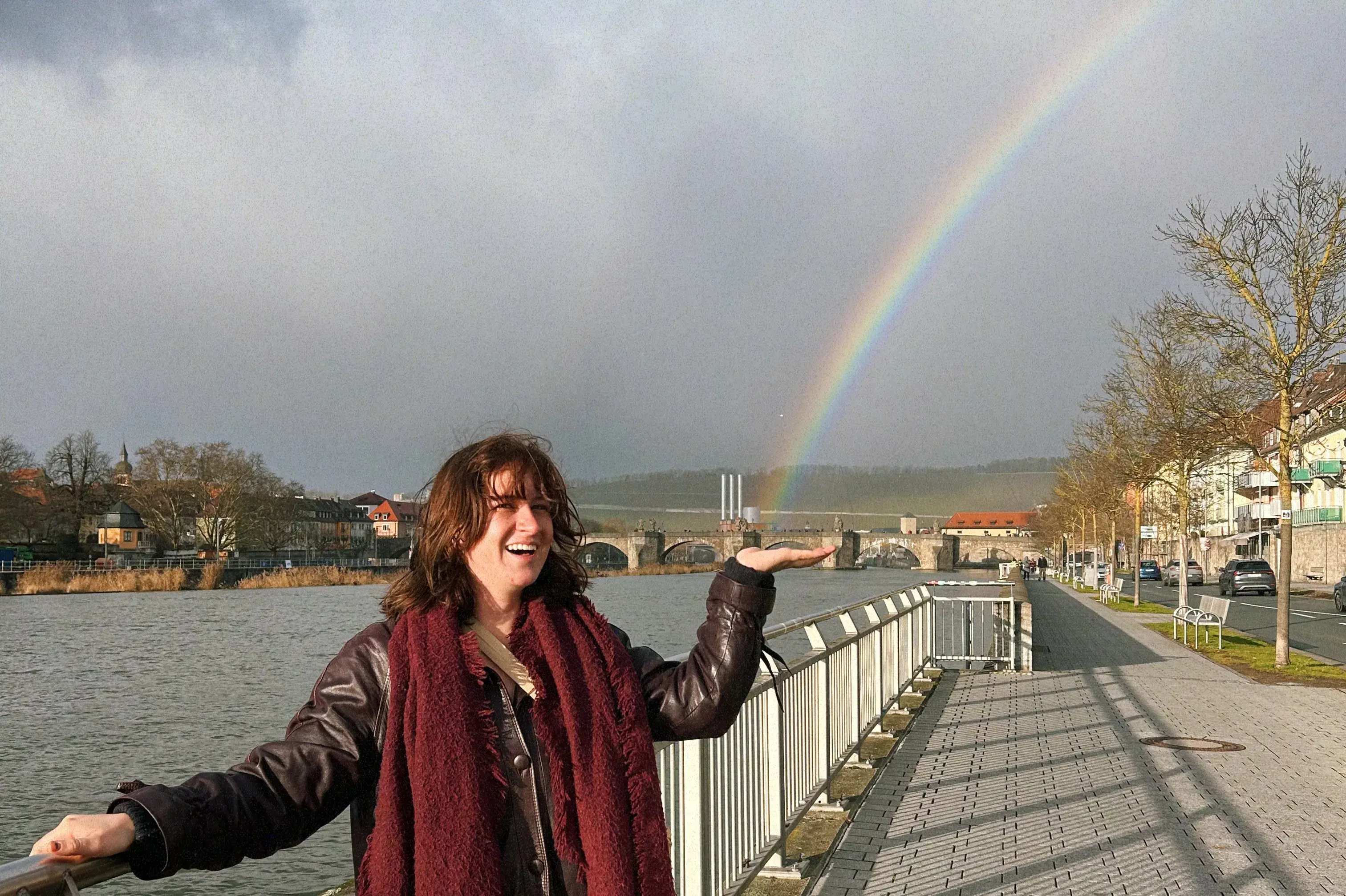 Daisey posing with rainbow