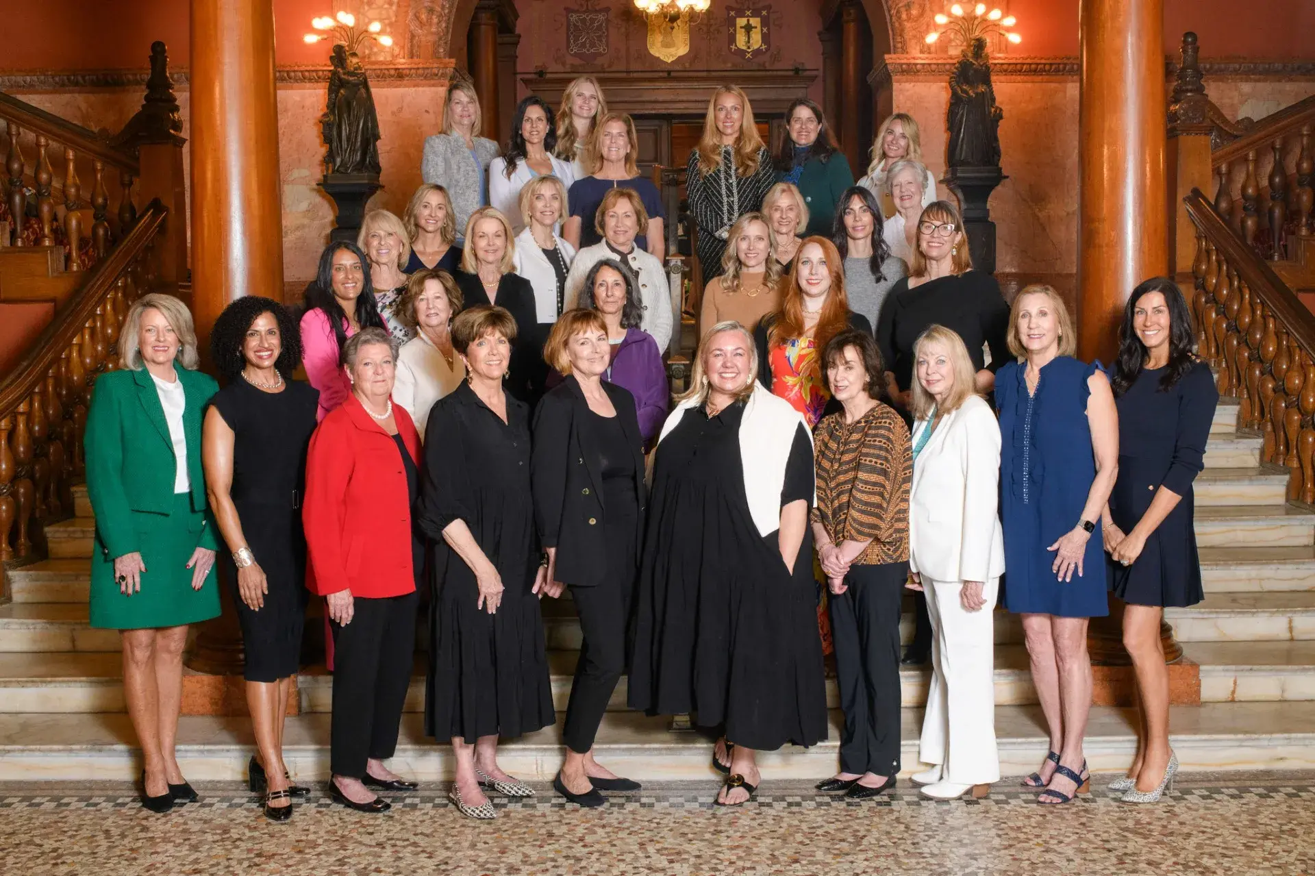 Women of Vision Group Photo on the stairs near the dining hall of Ponce.