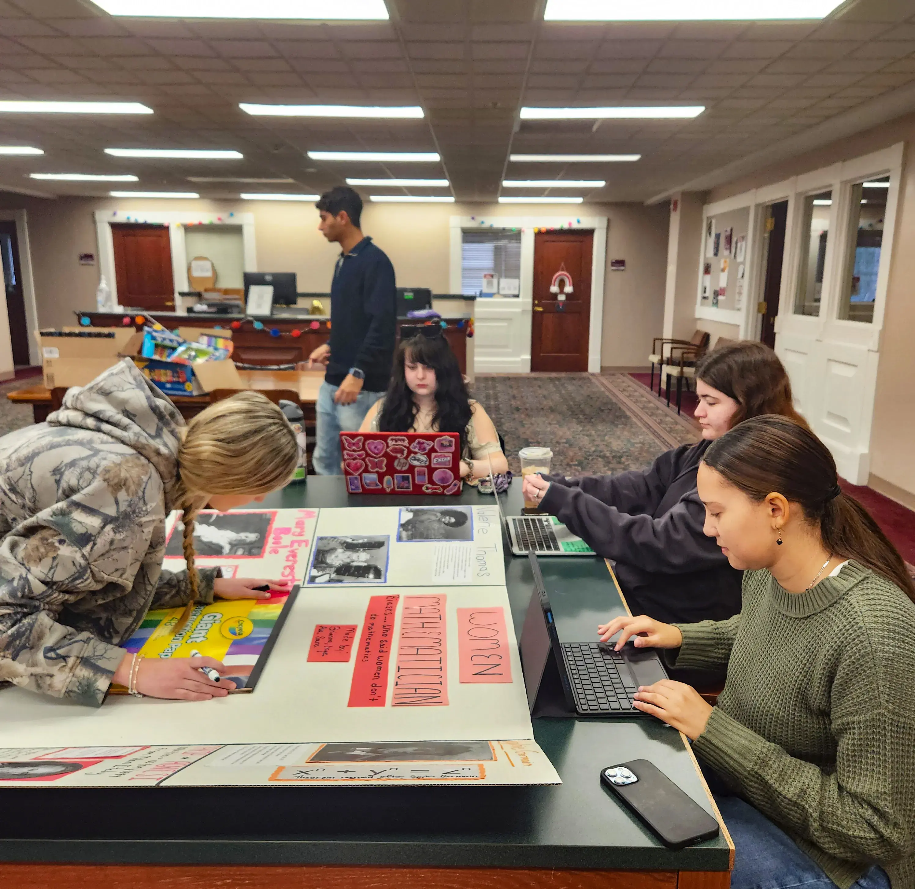 Students working on final poster boards