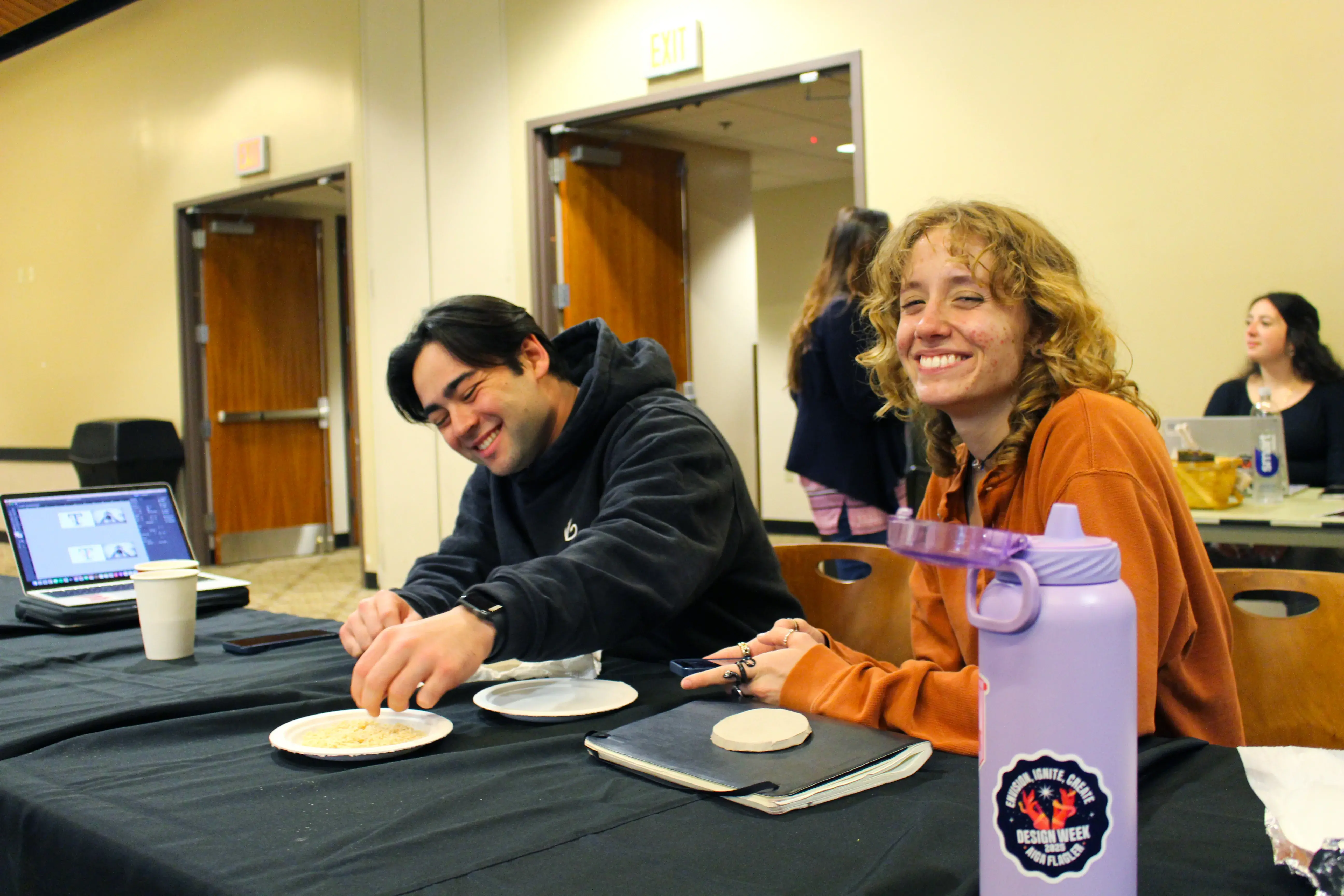 Rachel and peer sitting at table during Design Week