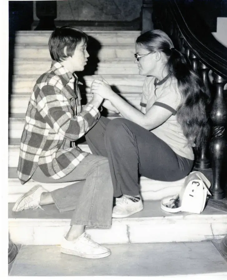 Early Deaf/ Deaf Ed. students signing on Rotunda steps