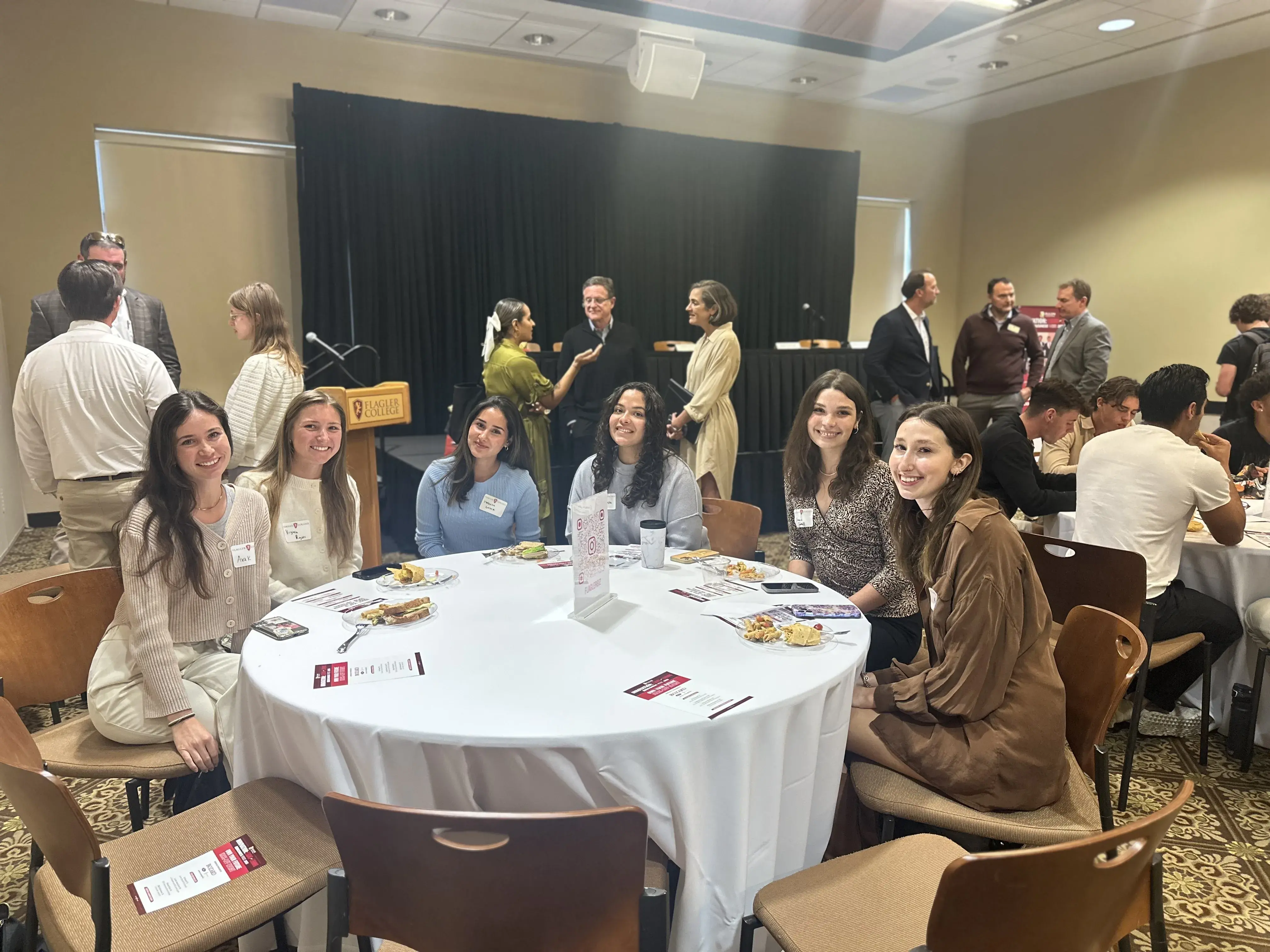 Own your future event students around a table