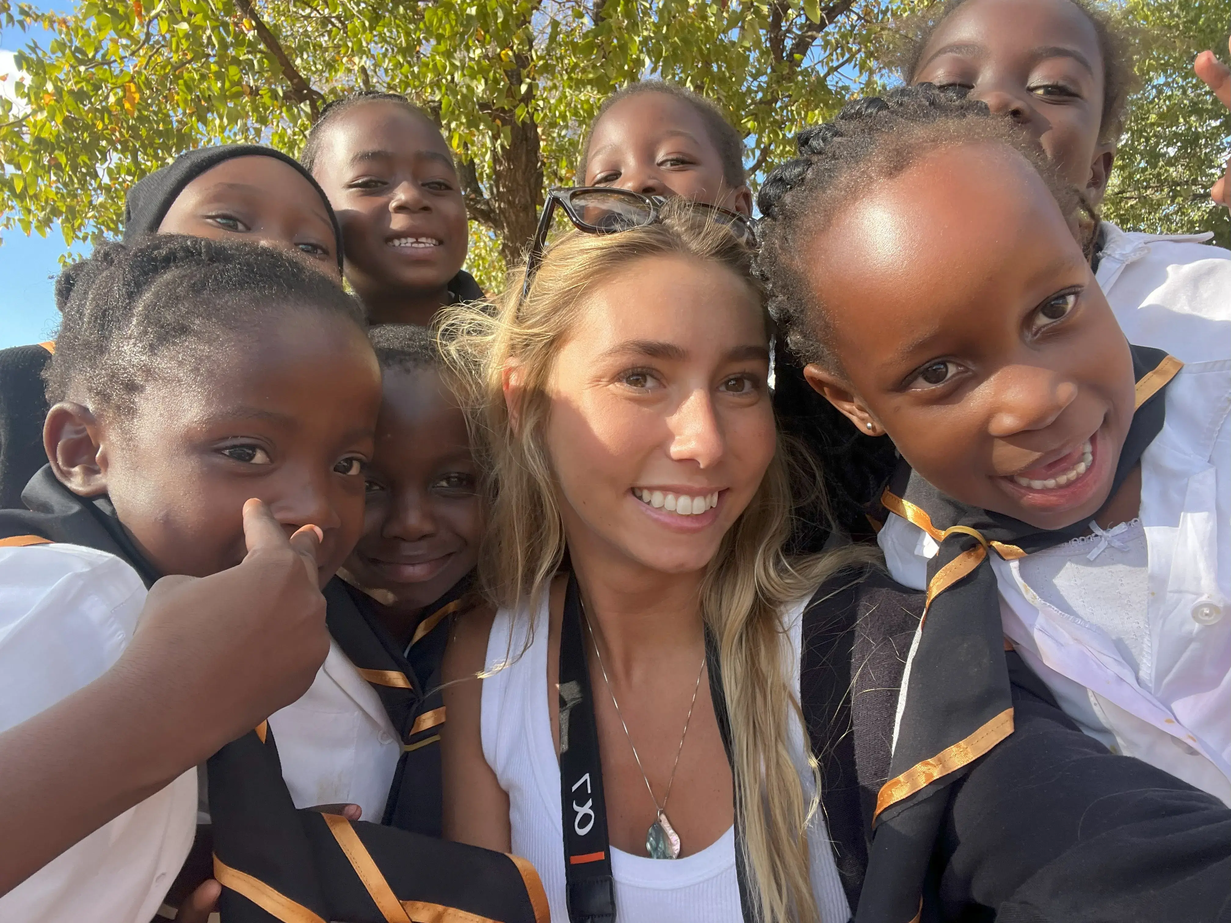 Olivia Lockett with children in Africa