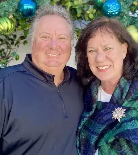 Donna and Brian Washburn smile for a selfie-style photo