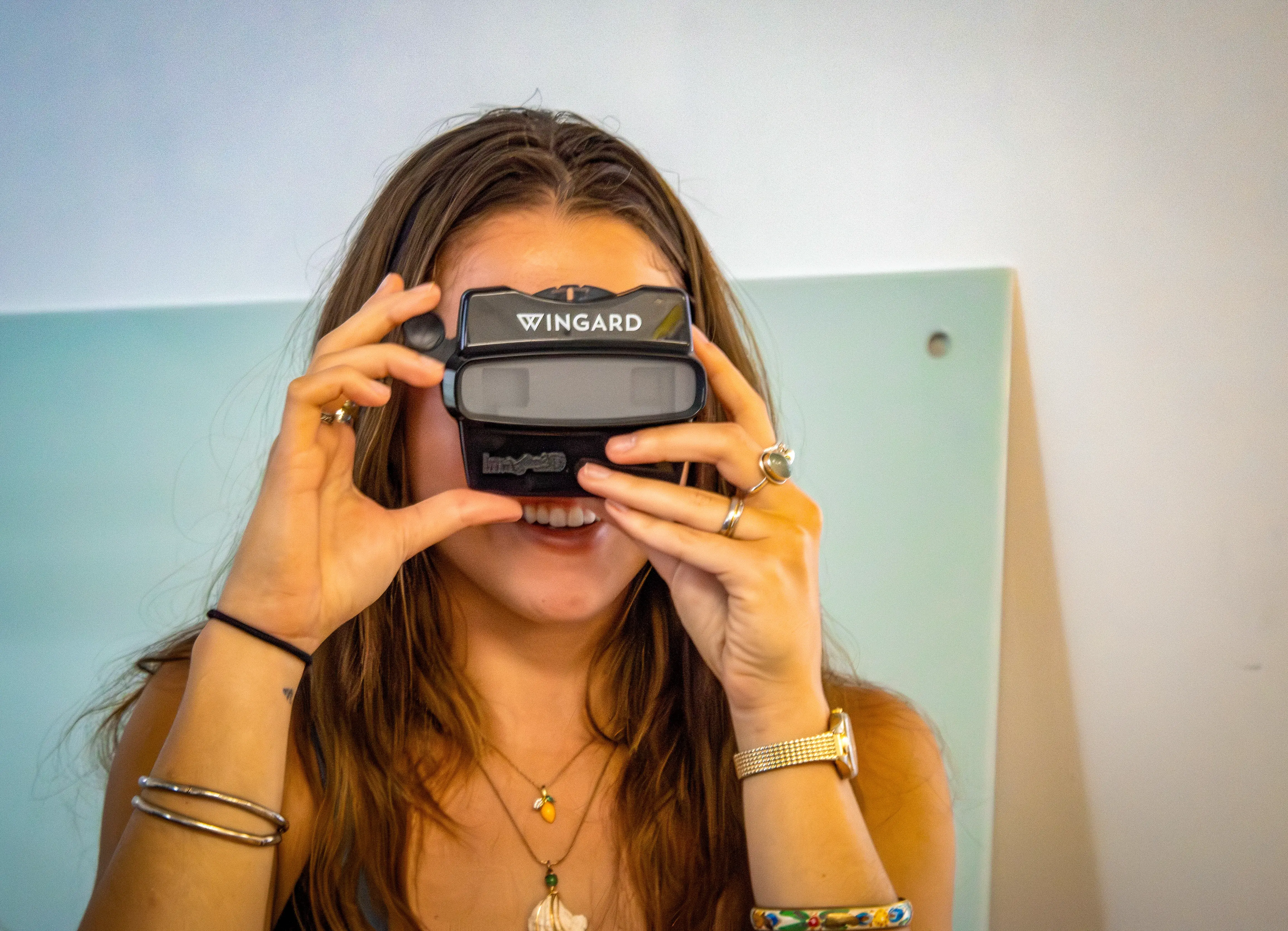 A student looks through a Wingard branded viewfinder