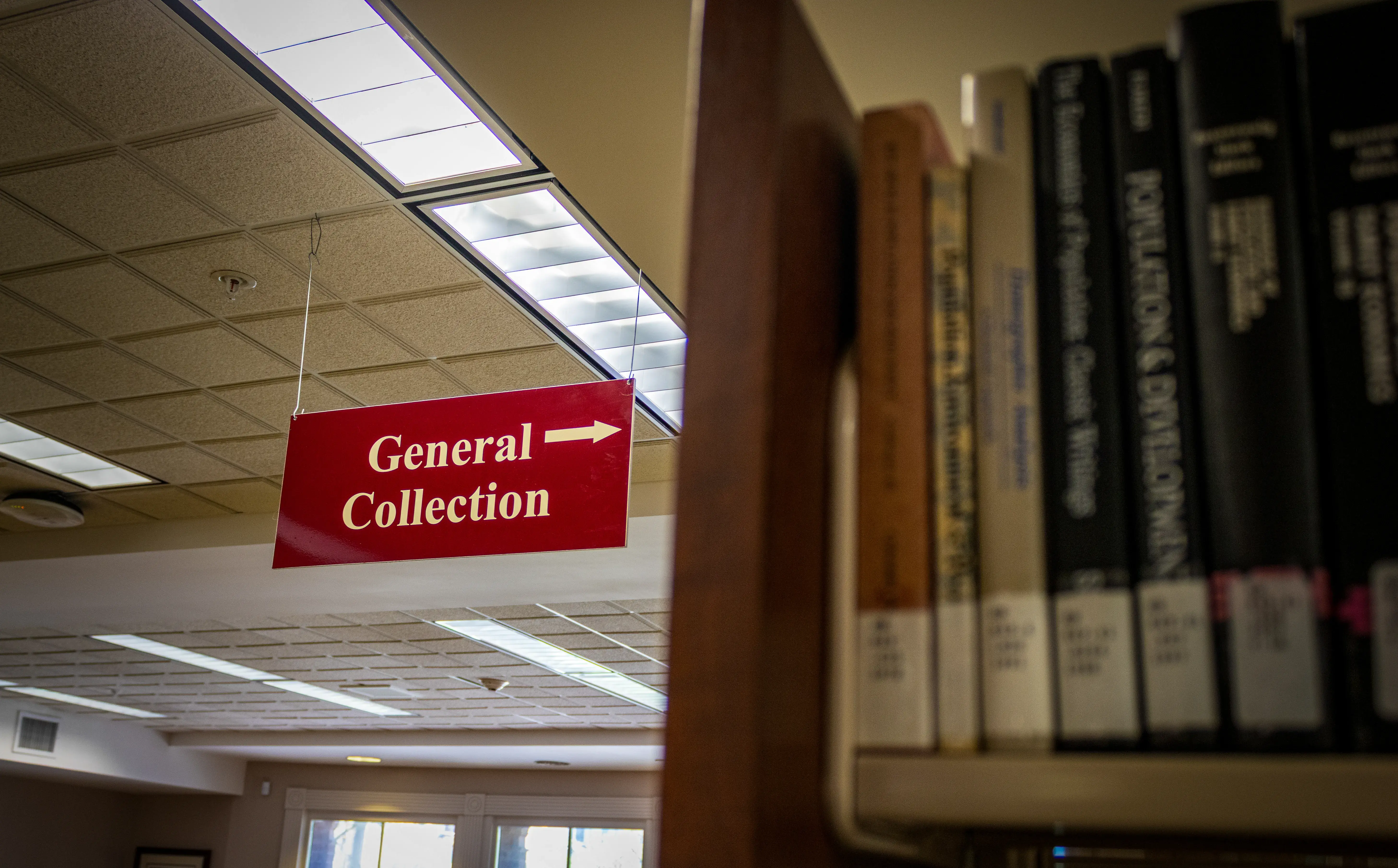 A picture inside of Proctor Library of a sign that says "General Collection"
