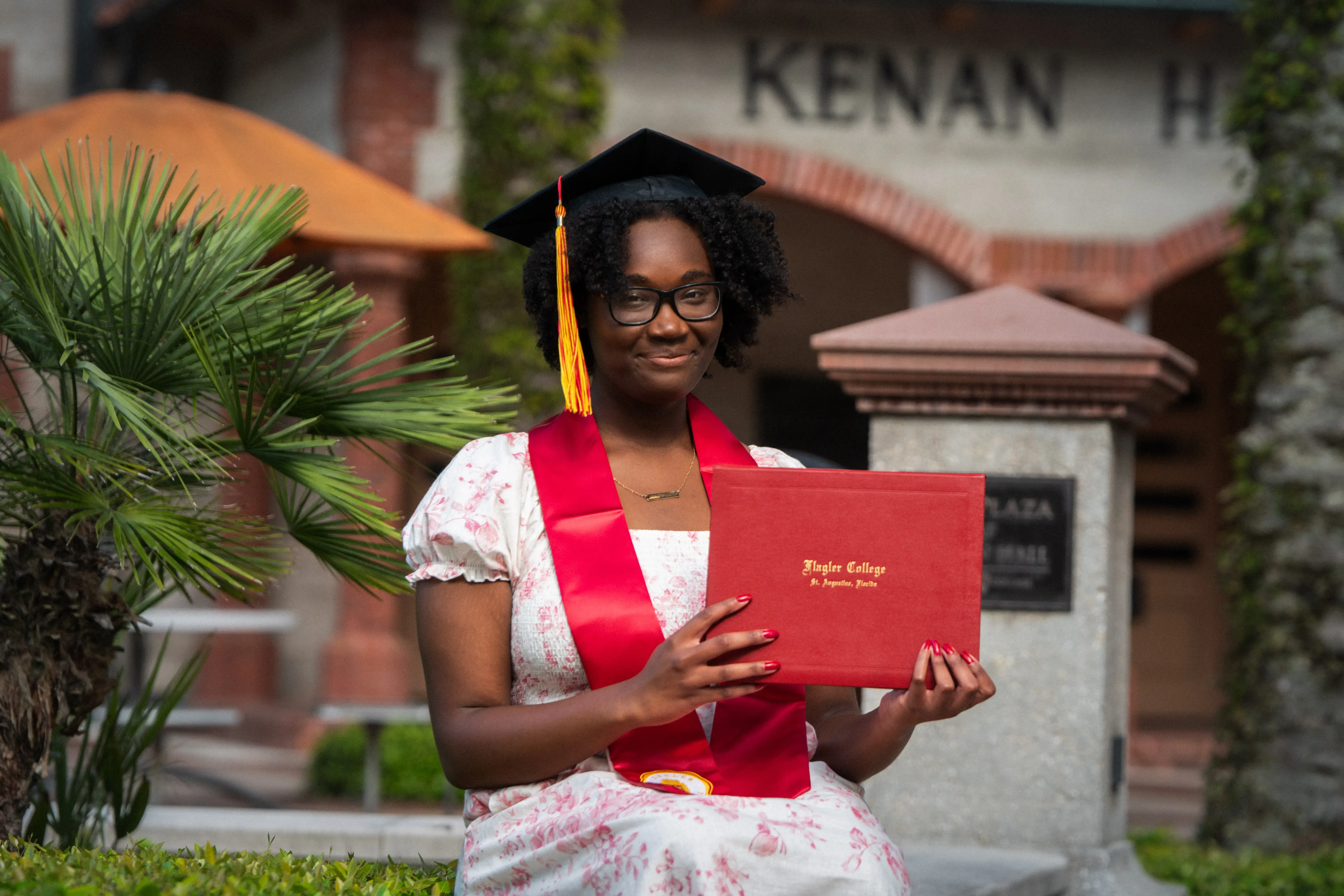 Destiny Durand holding her diploma