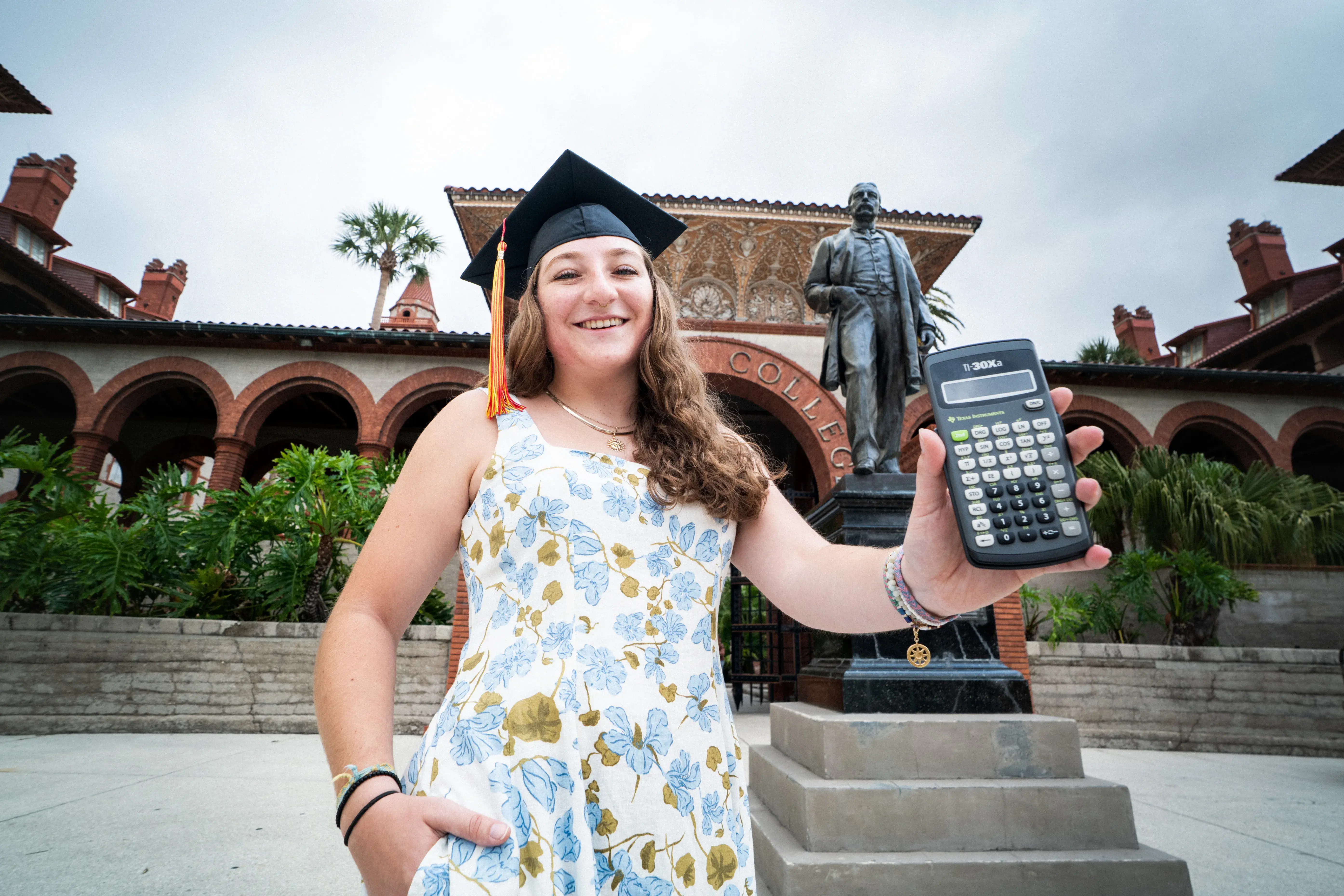 Christina Mark holding a calculator