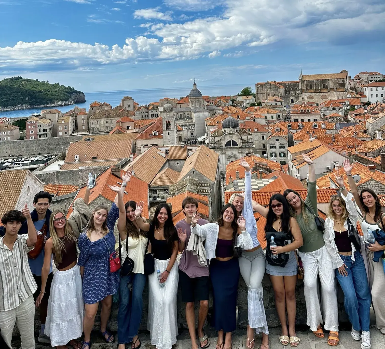 Students pose with a stunning bakground of Dubrovnik