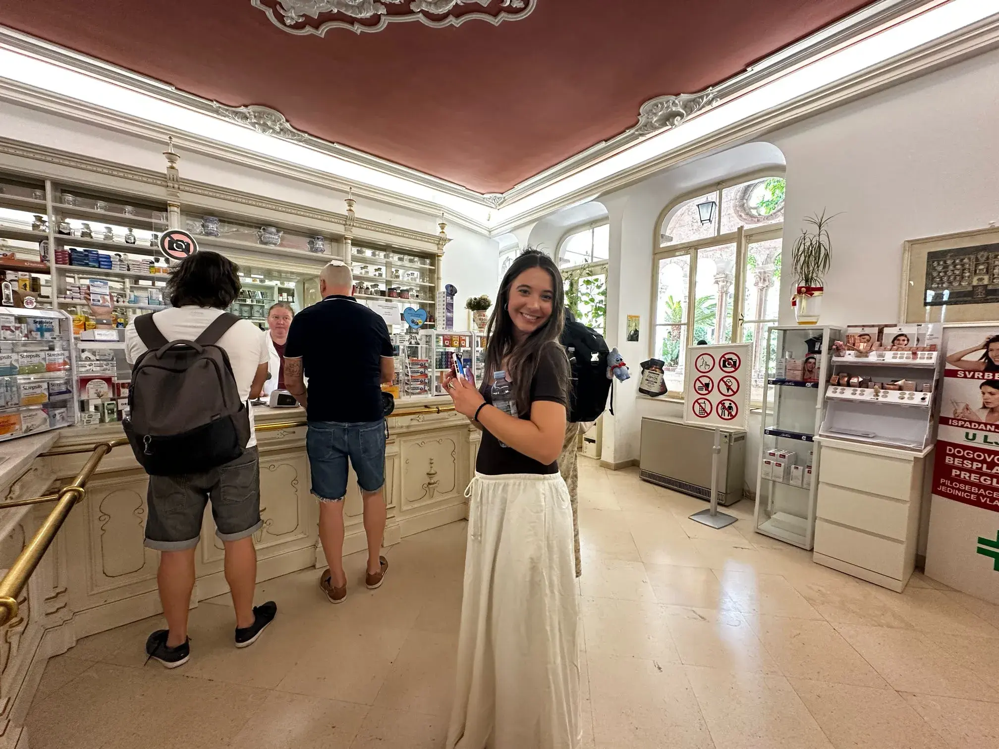 A student stands in the Franciscian Monestary/s Pharmacy in Dubrovnik