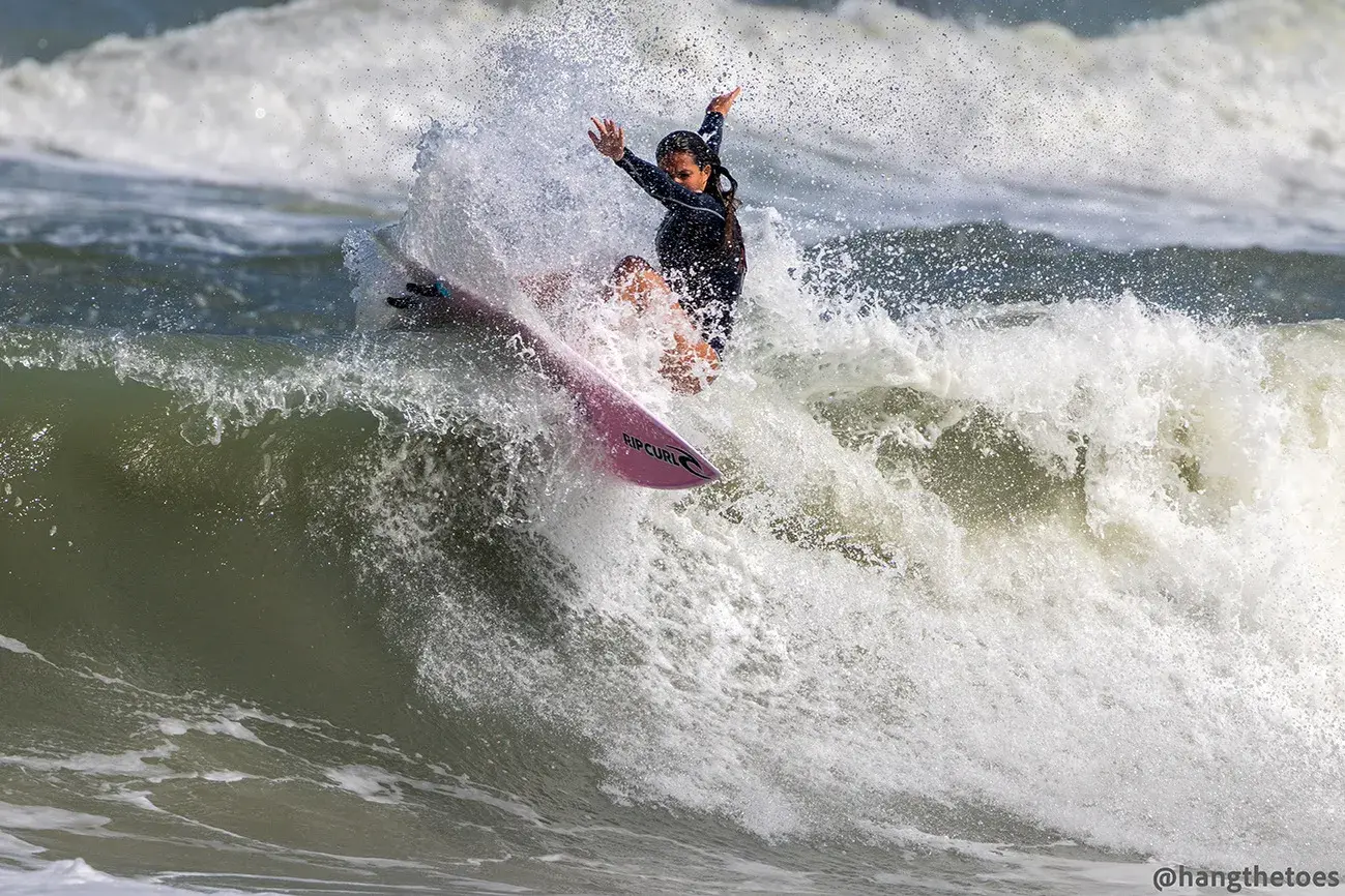 Callie Hertz surfing a wave
