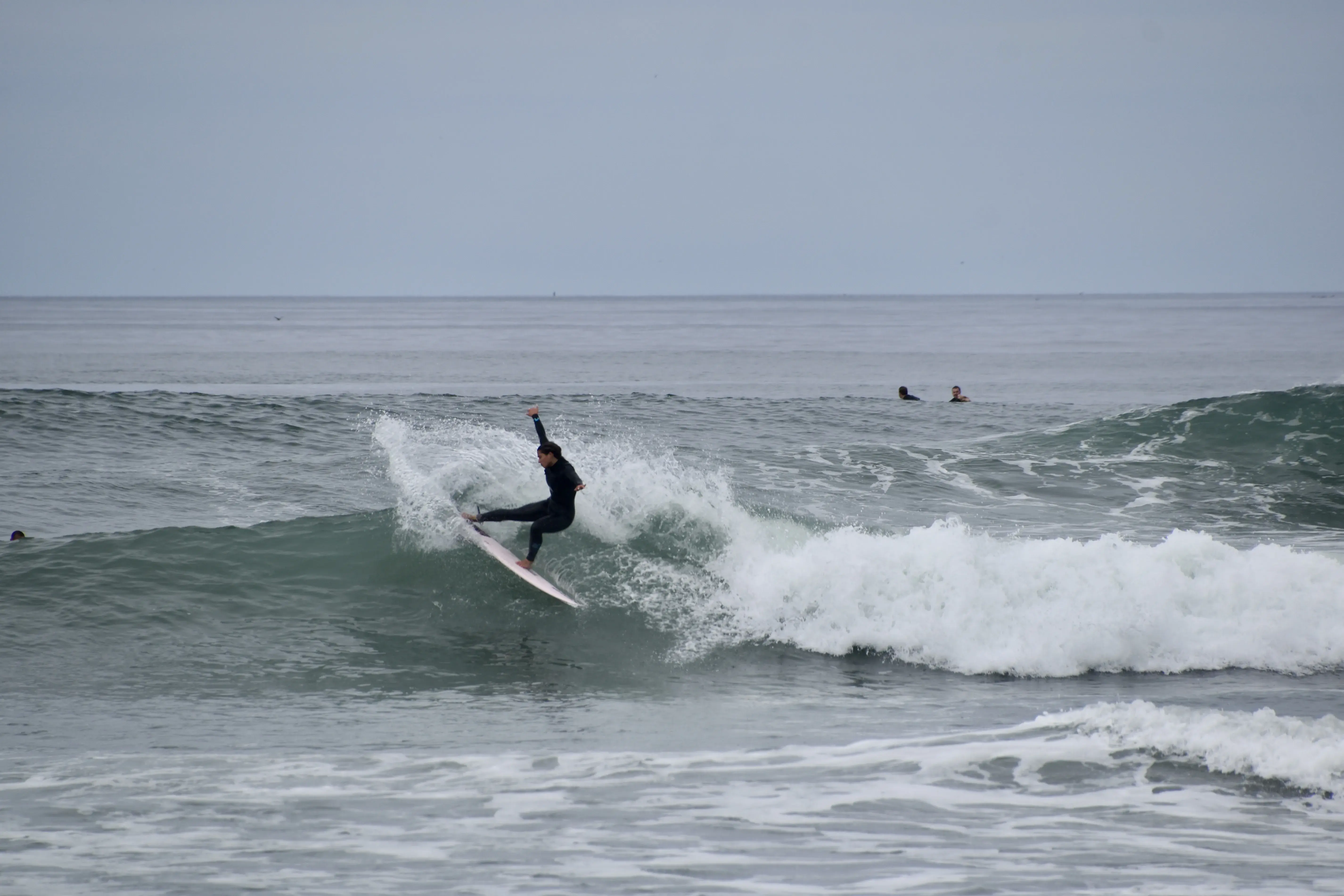 Callie Hertz surfing another wave