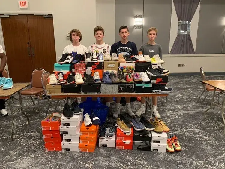 A young Logan Sarosi showcases his sneaker reselling business