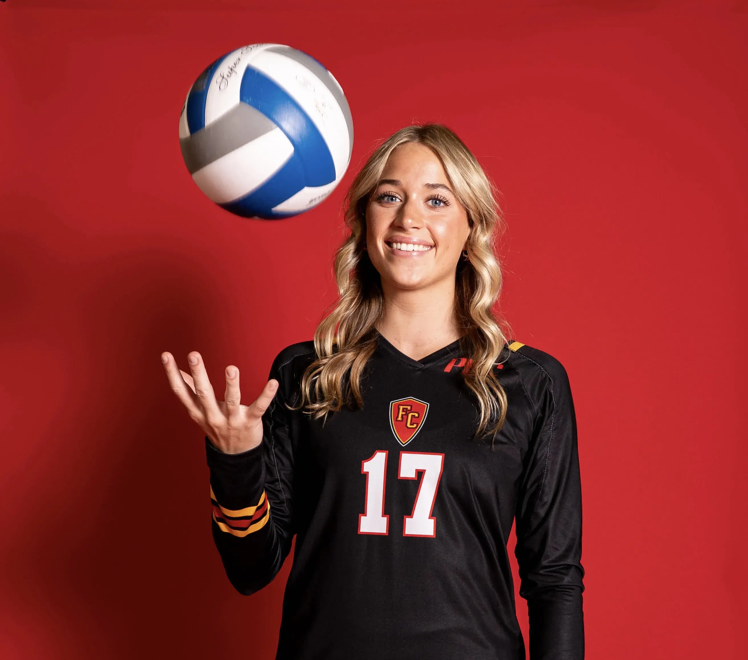 Jilly Young tossing a ball in the air