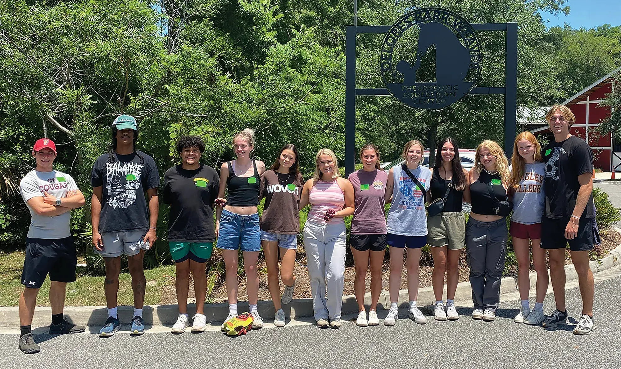 Students lined up posing in front of farmer market