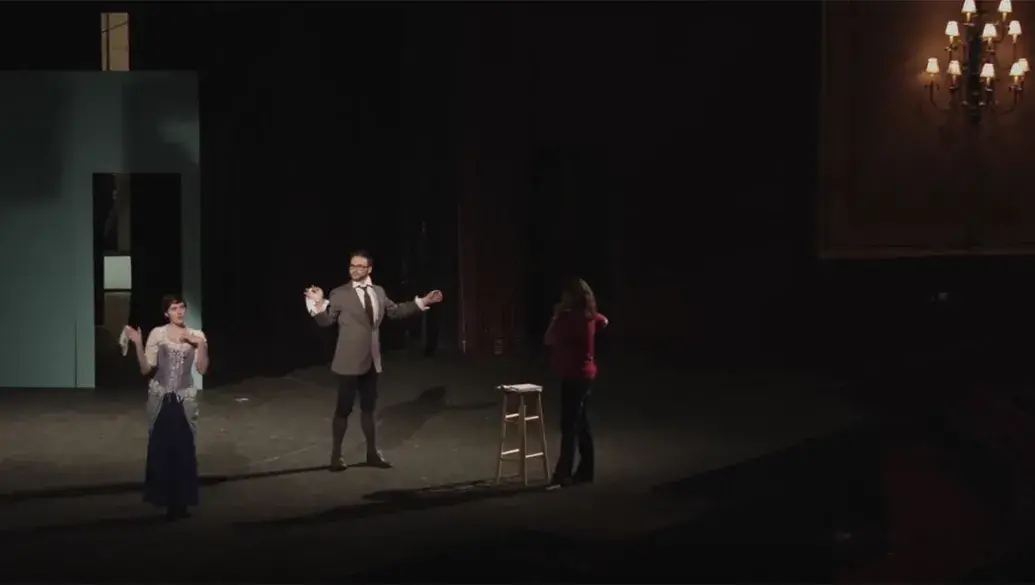 Theatre.jpg Flagler students rehearse play on stage as profesor directs